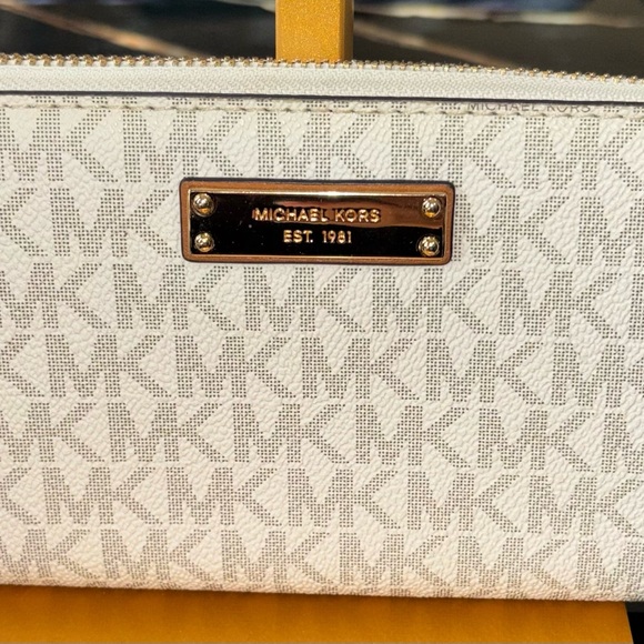 Michael Kors Handbags - Michael Kors Cream Monogram Clutch